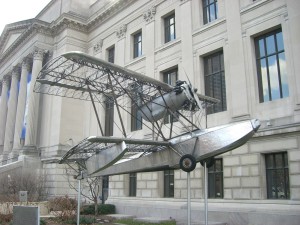 First ever stainless steel plane in front of Benjamin Franklin Institute.